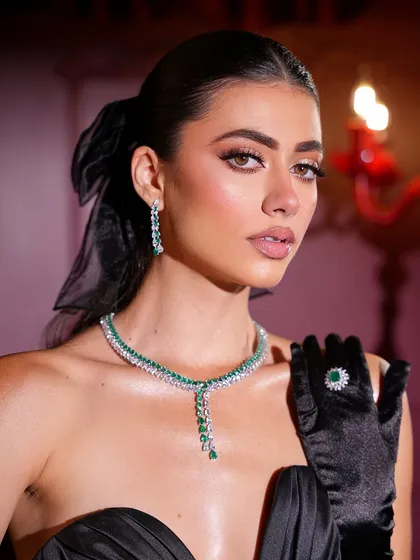 The details of the look, from the sparkling jewelry to the perfectly blended eyeshadow.
