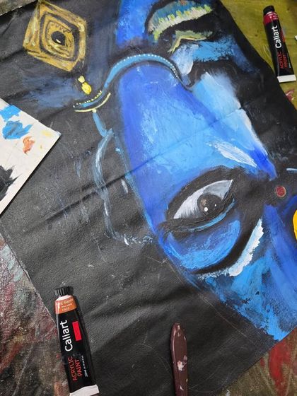 A powerful, close-up portrait in deep blue tones, demonstrating expressive techniques taught in our advanced acrylic workshops.