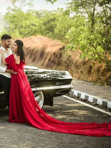 For couples who love a classic vibe, we incorporate elements like vintage cars to add timeless charm to your photoshoot. This pre-wedding session combined a bold red gown with a classic Chevrolet for an unforgettable look.