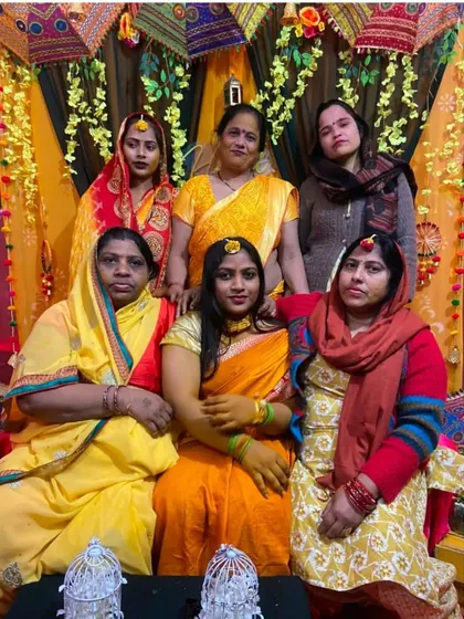 A beautiful family portrait taken against the traditional Haldi backdrop I designed. These are the memories that last a lifetime.