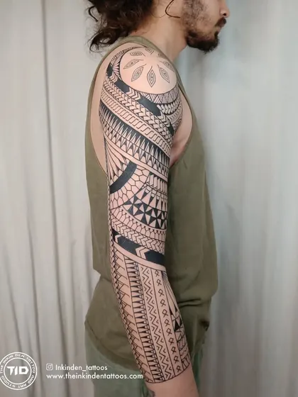 This full, freehand Maori sleeve is a testament to cultural storytelling through ink. Each pattern is drawn directly onto the skin to flow with the body's form, representing a unique journey of strength and heritage.