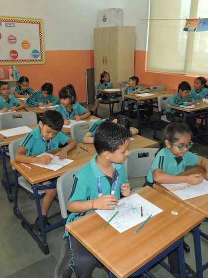 Students are focused on a poster-making competition to celebrate Gandhi Jayanti, with themes of peace and non-violence.