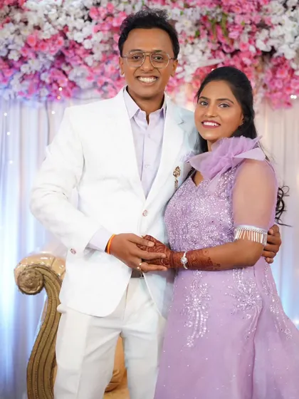 A happy couple portrait from their engagement, their smiles lighting up the room.