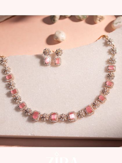 The full view of our pink gemstone necklace and matching earrings. This Italian-designed set from our Zira collection is perfect for festive occasions, offering a vibrant yet elegant look.
