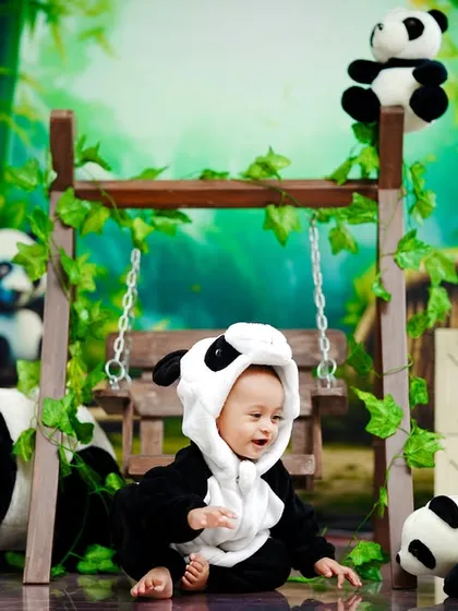 A candid moment of play during our adorable panda-themed baby shoot.