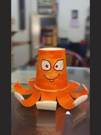 Who knew a paper cup could have so much personality? This cheerful octopus is a finished piece from one of our popular kids' craft sessions, where we turn everyday items into imaginative works of art.