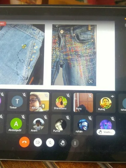 This is what our online classroom looks like. In this live Google Meet session, we are teaching creative mending techniques for old jeans. Our interactive format allows every child to follow along, ask questions, and share their progress right from home.
