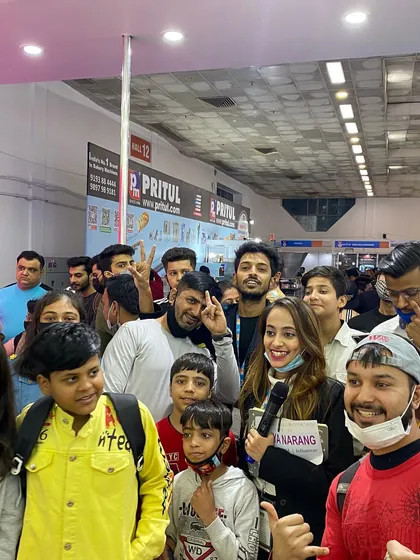 A happy group photo with audience members after a successful show. Creating positive experiences like this makes your brand more memorable.