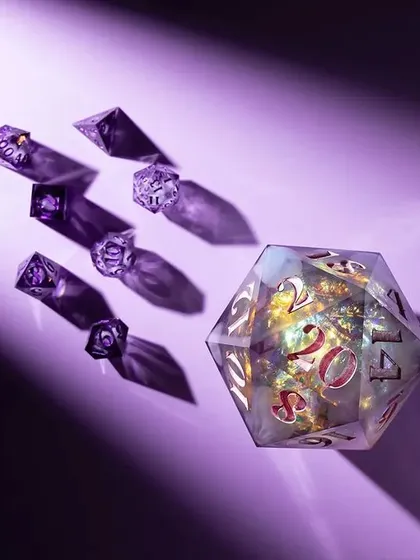 An abstract and creative shot using a purple background and gobo lighting to cast dramatic shadows from the dice. This artistic approach creates a sense of mystery and magic.
