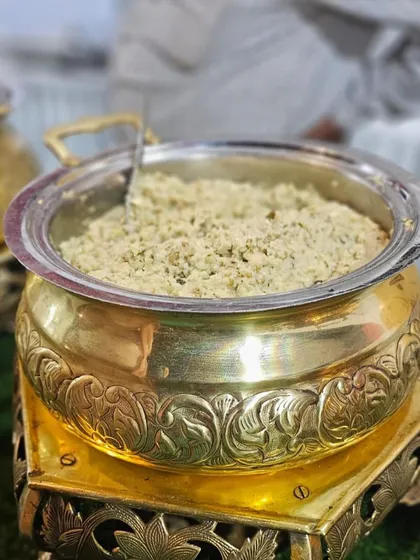 A traditional Gujarati sweet or savory dish served in an ornate brass bowl. I believe in authentic presentation that honors the culinary heritage of the food I serve.