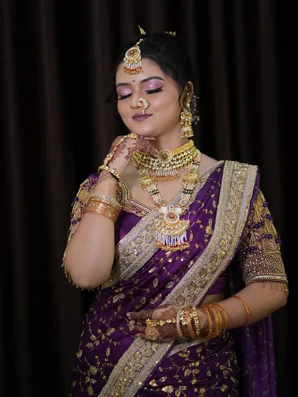 Another elegant pose of the Maharashtrian bride, highlighting the flawless makeup and traditional attire.