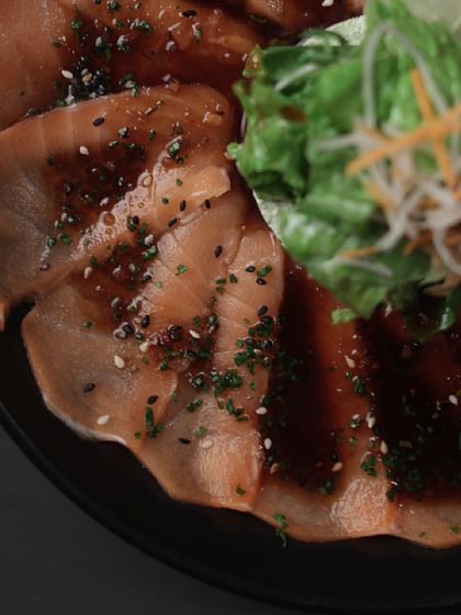Reinventing passion on a plate. Our Asian cuisine, like this salmon carpaccio, is prepared to satisfy your hunger and is incredibly irresistible.