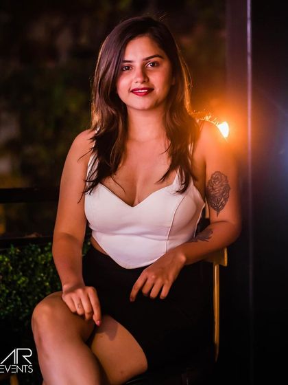 A guest with a tattoo, sitting in the lounge area.