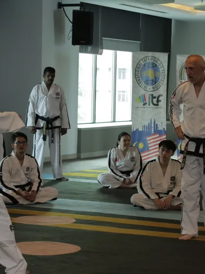 Observing a demonstration by a Grand Master at an IIC in Malaysia. Watching the highest-level practitioners is a profound learning experience.