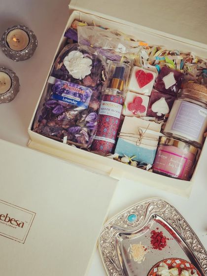 My "Romantic Bloom" hamper is filled with beautiful floral and sweet scents. It includes lavender potpourri, Romantic Bloom body mist, a Berrylicious body scrub, card-themed soaps, and a Sensual Fleur Bloom candle.