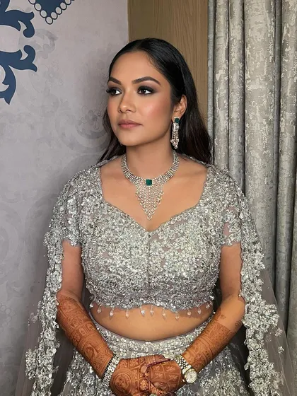 Smokey glam for Ishita's cocktail look. Classic and timeless, this stunner is ready to turn heads with her sultry eyes and flawless glam.