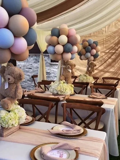 Celebrating a new arrival? We design adorable and elegant setups for baby showers and naming ceremonies, like this teddy bear-themed table with soft-hued balloons and floral arrangements.