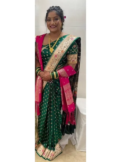 For this client's engagement, I pre-pleated a gorgeous green Banarasi saree in a Maharashtrian shalu style. This draping method highlights the rich fabric and ensures the bride is comfortable and elegant throughout her event.