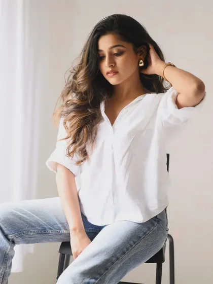 A clean, minimalist portrait that feels fresh and modern. Using soft, bright light against a simple white background, we captured a relaxed and natural moment that highlights genuine personality.