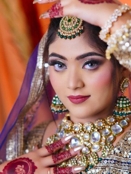 A close-up of the bridal makeup, highlighting the silver glitter eyeshadow and the perfectly matched lip color.