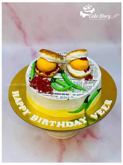 A delicious-looking Vada Pav cake, perfect for any Mumbaikar's birthday. The details, like the red chutney powder, make it look just like the real thing.