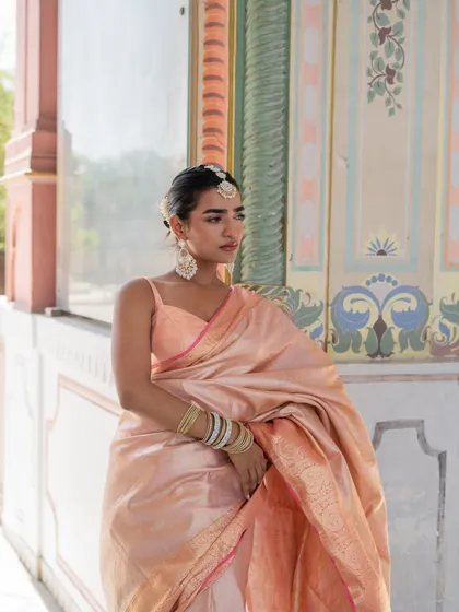 We are in a silk saree Banarasi mood. This baby pink silk saree is the epitome of grace and timeless beauty.