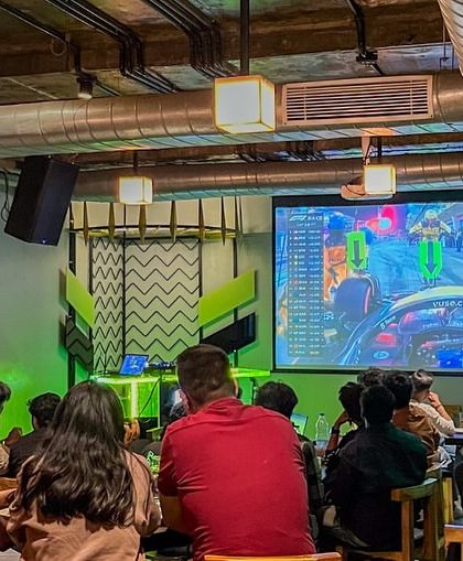 The view from the back. Our entire space turns into a stadium during big matches, with fans packed in to watch the game.