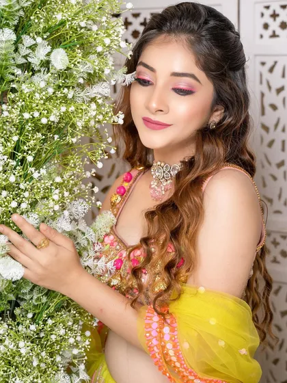 A vibrant and playful Mehendi look. The bright pink eye makeup beautifully complements the fun and colorful Papa Don't Preach outfit, creating a look that is full of personality.