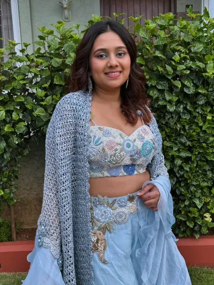 A happy and confident client, rocking her unique and colorful makeup look.