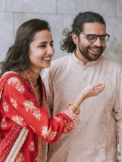 It's the small, unscripted moments that I love to capture. Here, the couple shares a lighthearted laugh during their engagement function.
