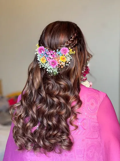A stunning heart-shaped floral hair accessory, a unique and beautiful choice for a Mehendi hairstyle.