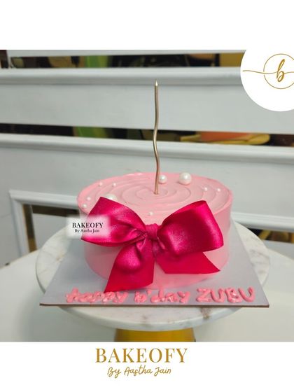 A simple and sweet pink bow cake. This design is perfect for any celebration, adding a touch of glamour with a single, perfectly crafted fondant bow.