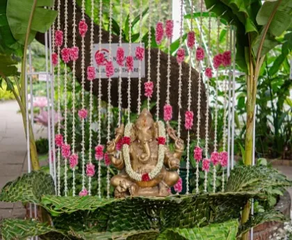 We believe every celebration should start with a blessing. This Ganesha installation, decorated with fresh banana leaves and strings of tuberose and carnations, provided a divine and traditional welcome for a South Indian wedding.