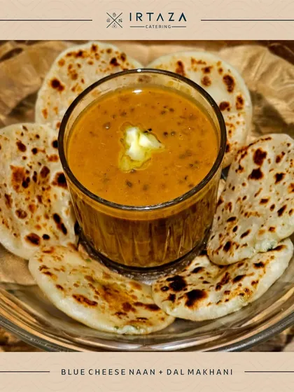 I take pride in reinventing classic Indian dishes. Here, I serve my signature Dal Makhani with delicate Blue Cheese Naan, offering a fusion of familiar comfort and gourmet flavor that always gets people talking.