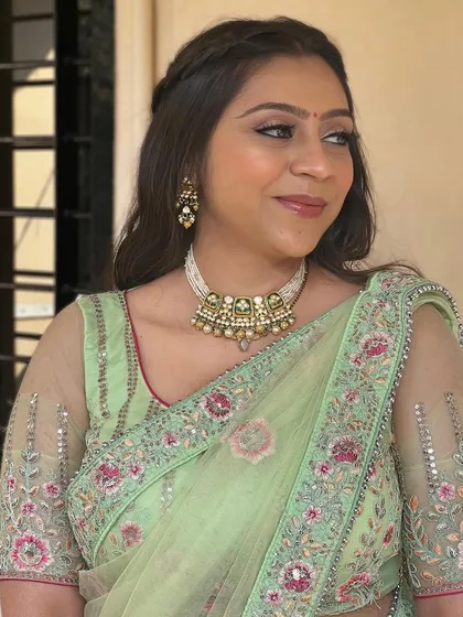 A side profile of this client, showing her elegant makeup.