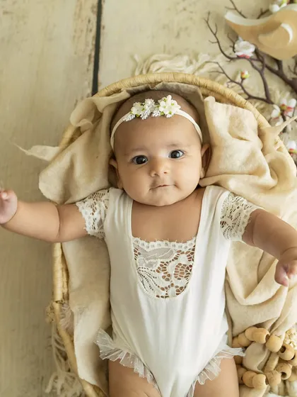 A beautiful, direct gaze. This baby's big, expressive eyes are the centerpiece of this simple and elegant portrait.