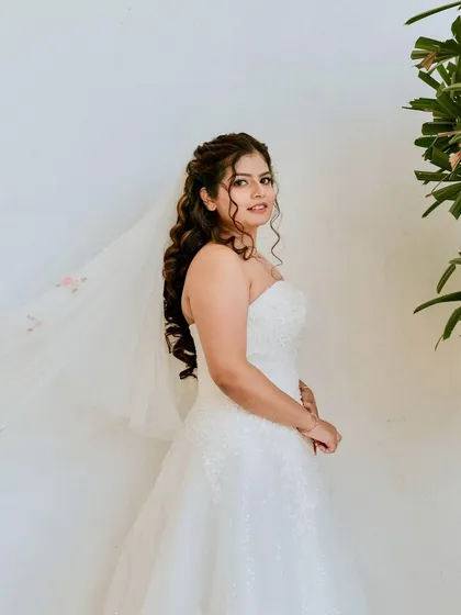 Soft curls, dreamy skin, and that classic white dress moment. A timeless bridal look that felt as graceful as it looked.