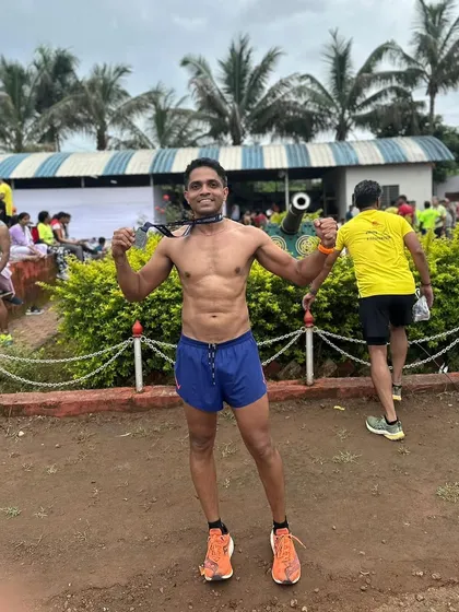 A triumphant pose after conquering the Satara Hill Half Marathon. The feeling of accomplishment is unbeatable.