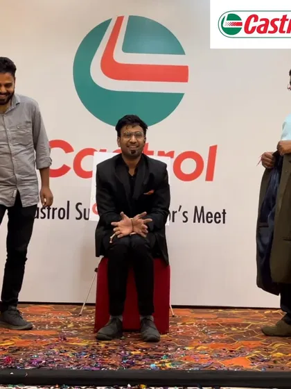 A fun moment on stage during a blindfolded illusion at the Castrol Distributor's Meet.