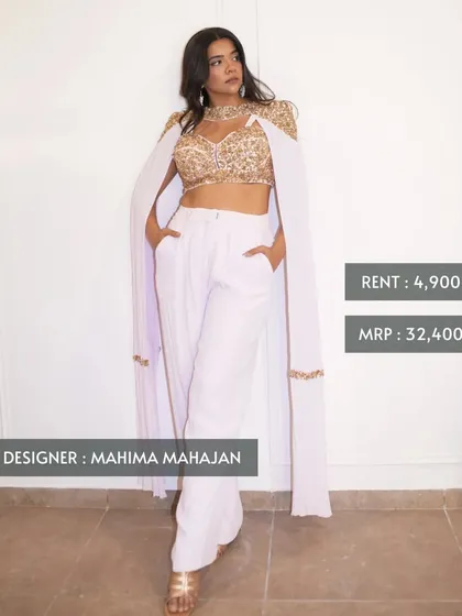 This is what smart luxury looks like. You can own this chic Mahima Mahajan cape top and pants set, originally priced at ₹32,400, for just ₹4,900. It's perfect for a modern wedding guest look.