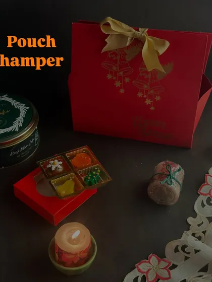 The Pouch Hamper, a slightly larger version that's perfect for gifting to colleagues or friends. It's a thoughtful way to share some festive sweetness.