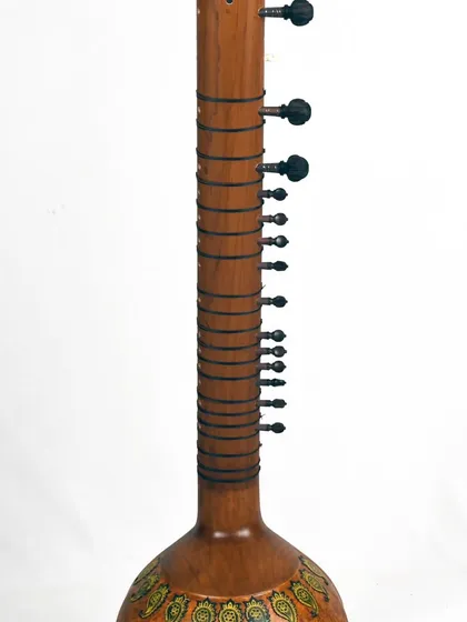 A back view of the Zen+ sitar, showing the full length of the instrument and the simple, elegant design.