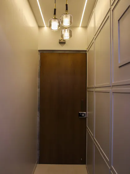 These pendant lights are used to illuminate an entryway, creating a welcoming first impression with their stylish design.