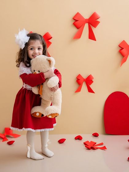 A big hug for her teddy bear. This little girl is full of love and sweetness in our Valentine's week photoshoot.