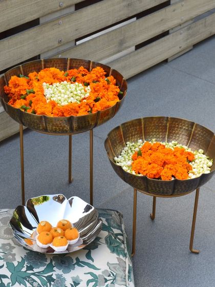 Transform your home into a vibrant space for Navratri with my stunning Urli decor. These hammered brass urlis on stands are perfect for floating flowers.