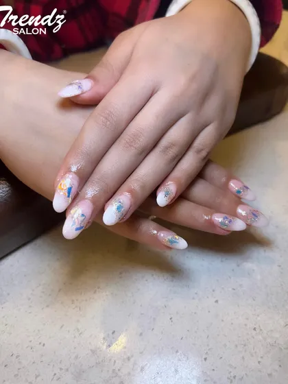 This delicate design is perfect for spring and summer. I used a milky white base on these almond extensions and applied beautiful, watercolor-style butterfly and floral decals for a soft, artistic look.