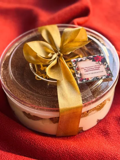 The Christmas edition Tiramisu tub, wrapped with a beautiful gold ribbon, making it a perfect holiday gift.