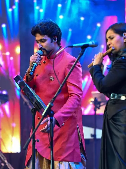 Sharing the stage with fellow artists is one of my greatest joys. Here I am, playing the flute during a high-energy fusion performance at the Bengaluru Ganesh Utsava, creating a dynamic dialogue between vocals and instruments.