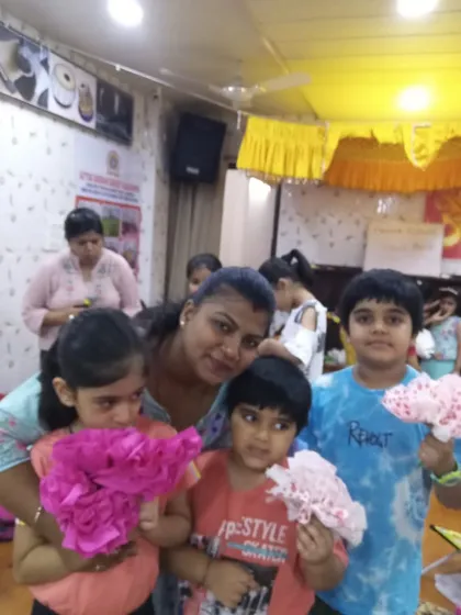 A close-up of our younger students with their tissue paper flowers. It’s a joy to see them so proud of what they have created with their own hands.