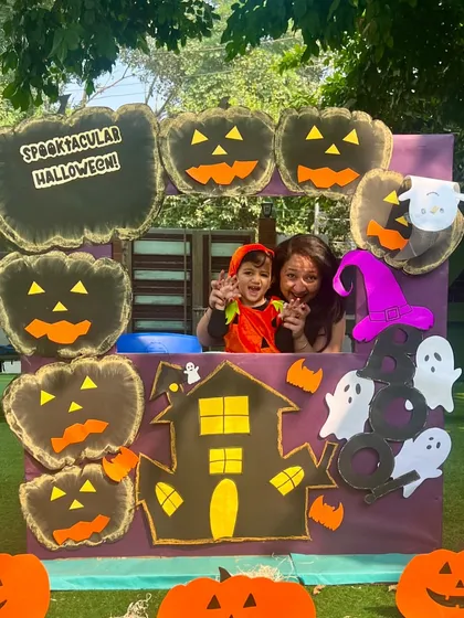 This little pumpkin and his mom are having a blast. Our events are designed to be fun and engaging for all ages.